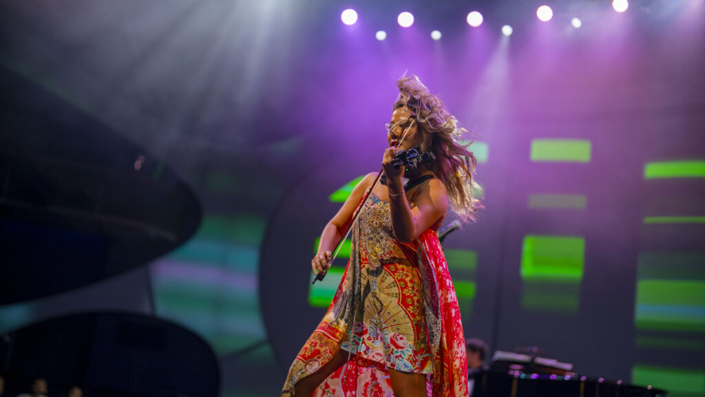 Violin maestro Yoomia preforming on Celebrity Edge