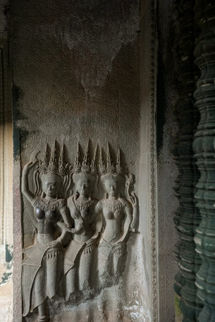 Dancing girls Apsara carvings on the walls of Angkor Wat