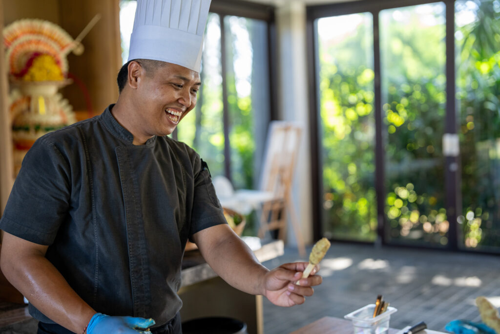 Chef Dharma demonstrating cooking Satay Lilit