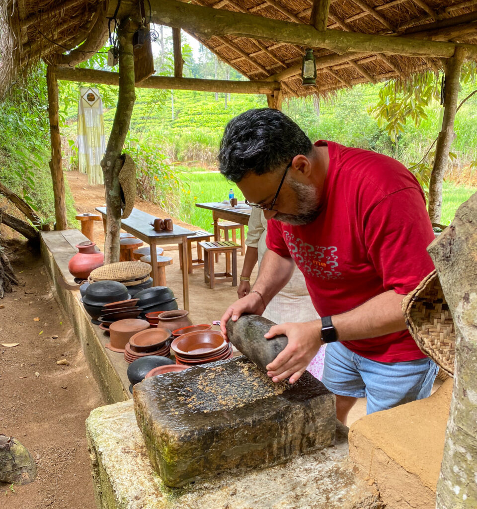 Grinding wet masala paste on the traditional stone grinder. Photo: Harmeet Sehgal
